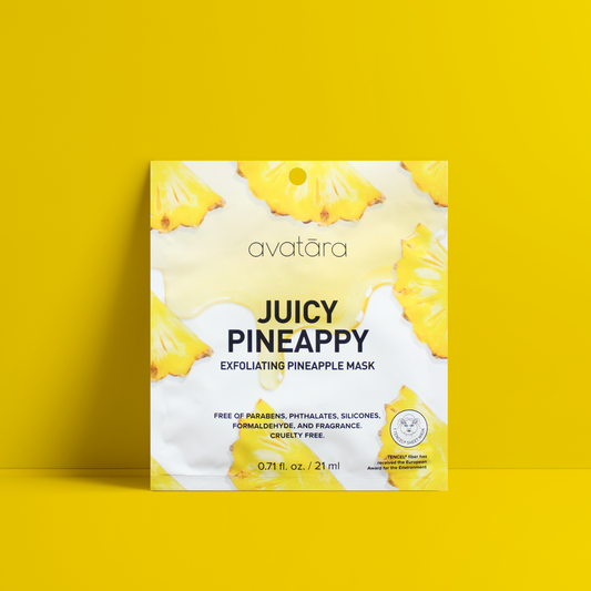 picture of avatara juicy pineappy exfoliating pineapple mask packaging resting on a bright yellow background